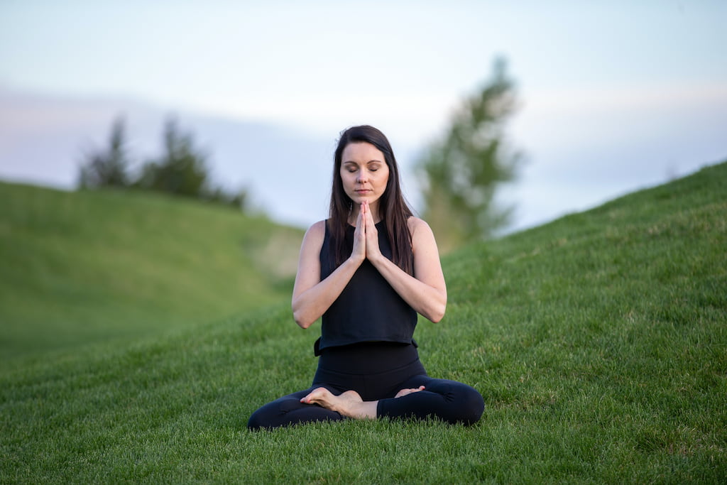 woman meditating in nature