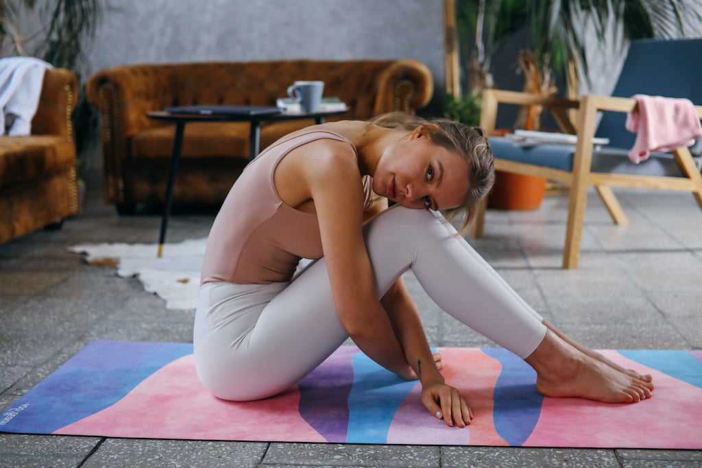 woman thinking on yoga mat