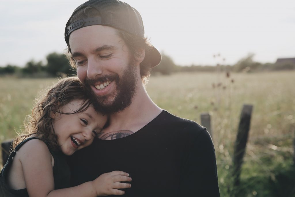 dad and his daughter laughing