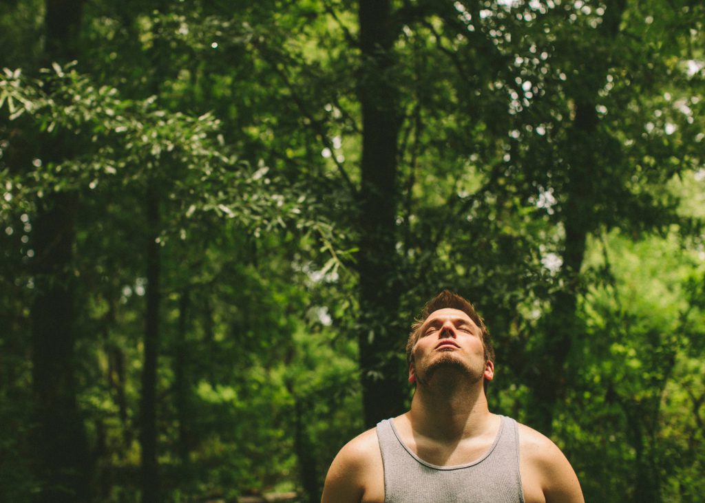 man breathing in nature