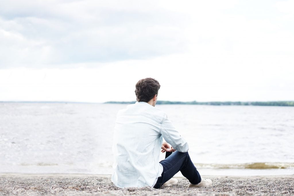 sitting near the sea