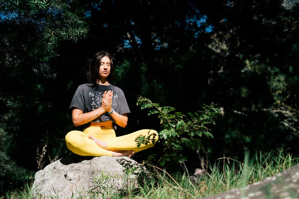 woman meditating in nature