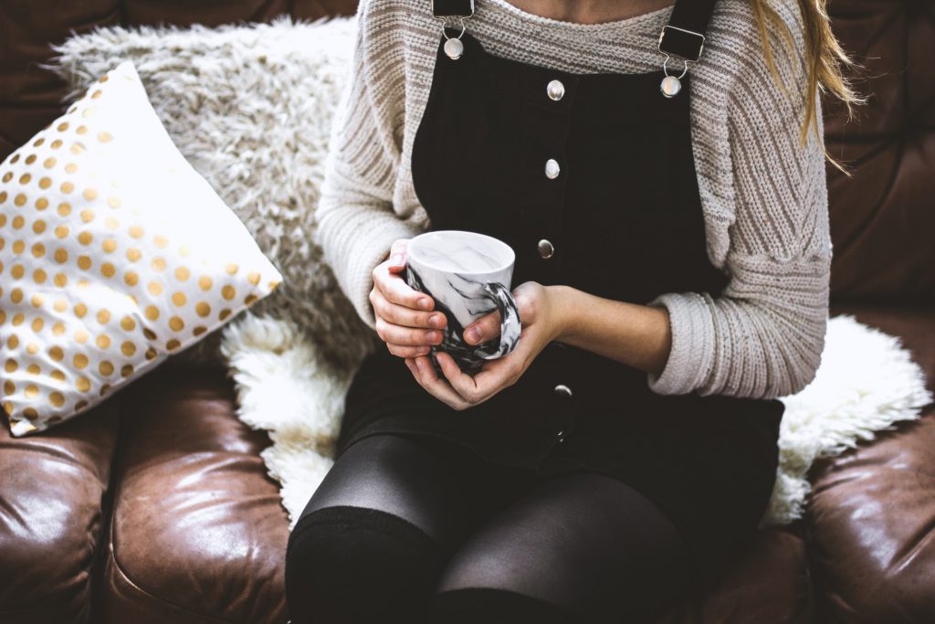 a person drinking a hot drink