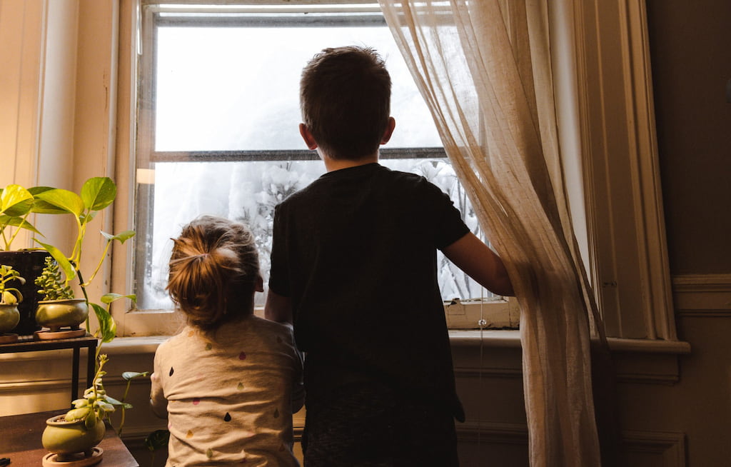 children in front of the window