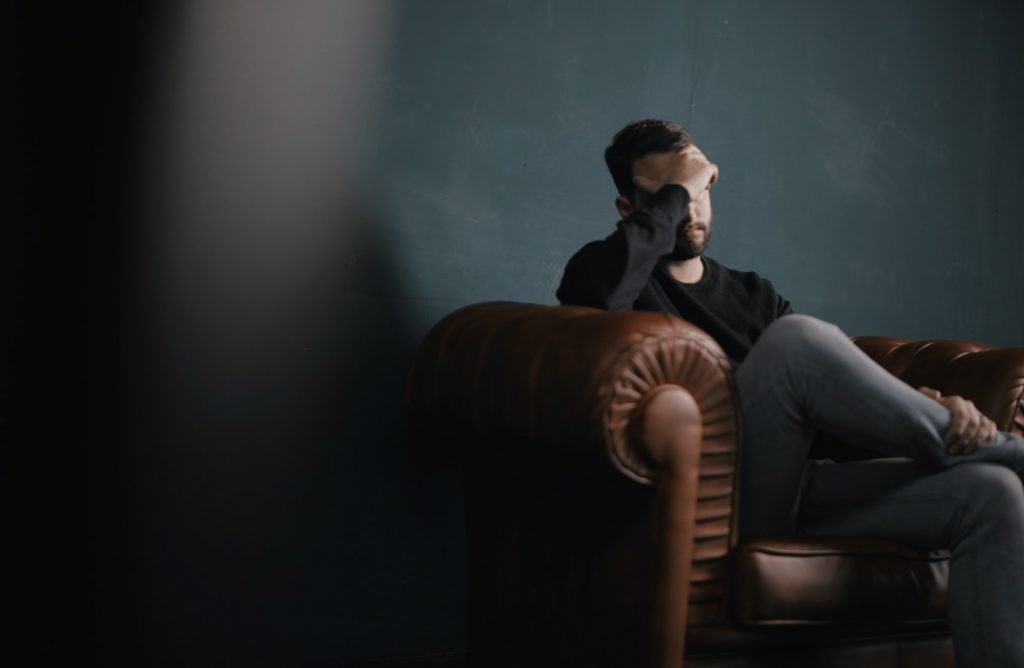 anxious man thinking on the couch