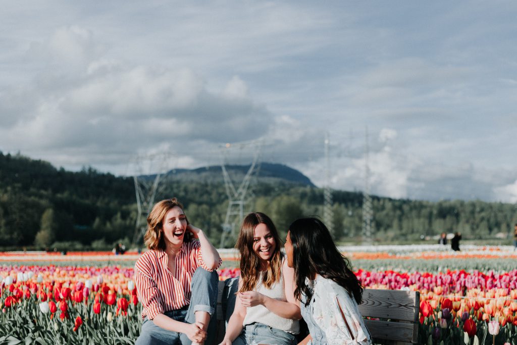 women laughing with friends