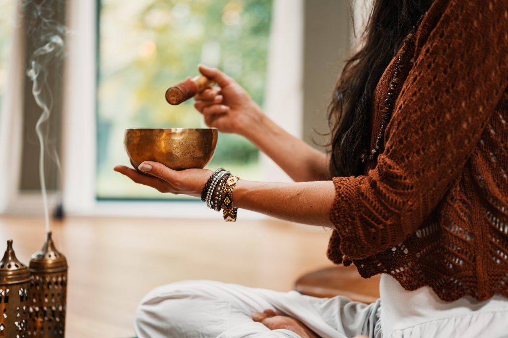 woman with a tibetian singing bowl