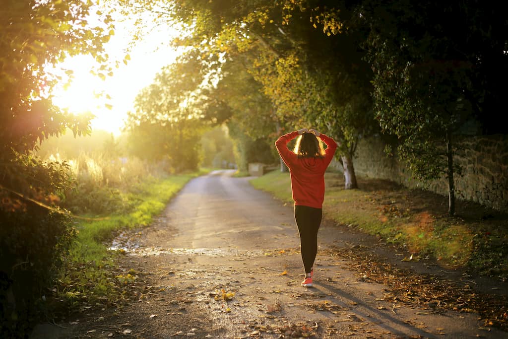 person walking in the forest