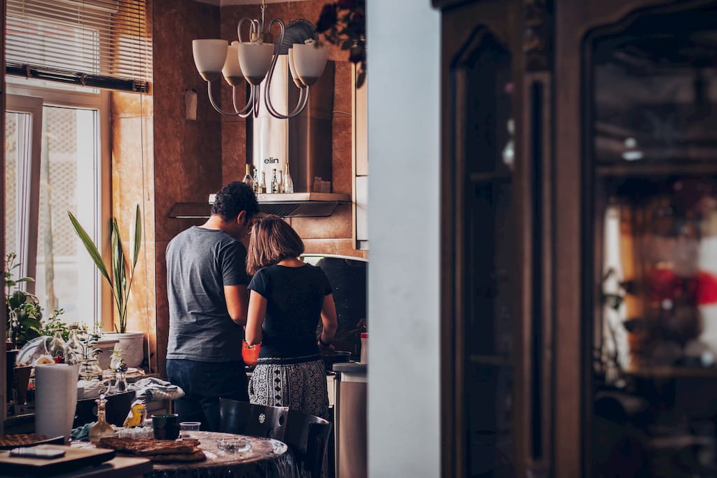 a couple in kitchen