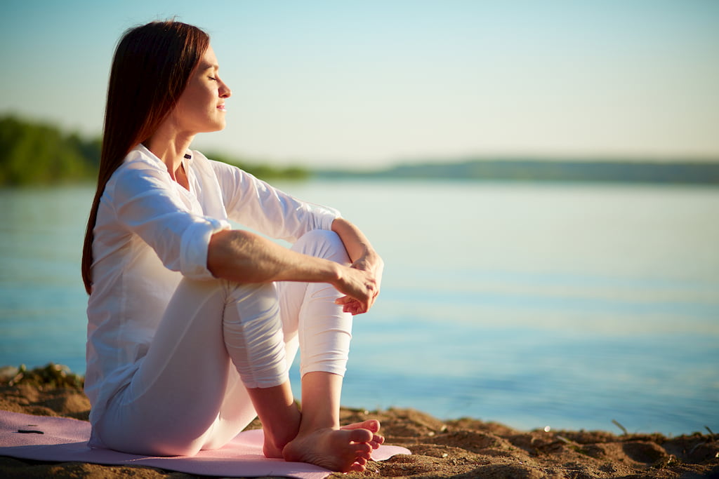 woman sitting near seaside