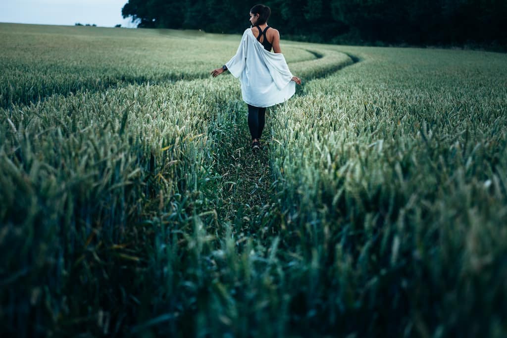 woman walking in the grass