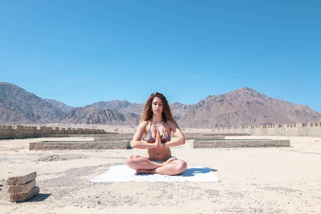 Woman meditating outside