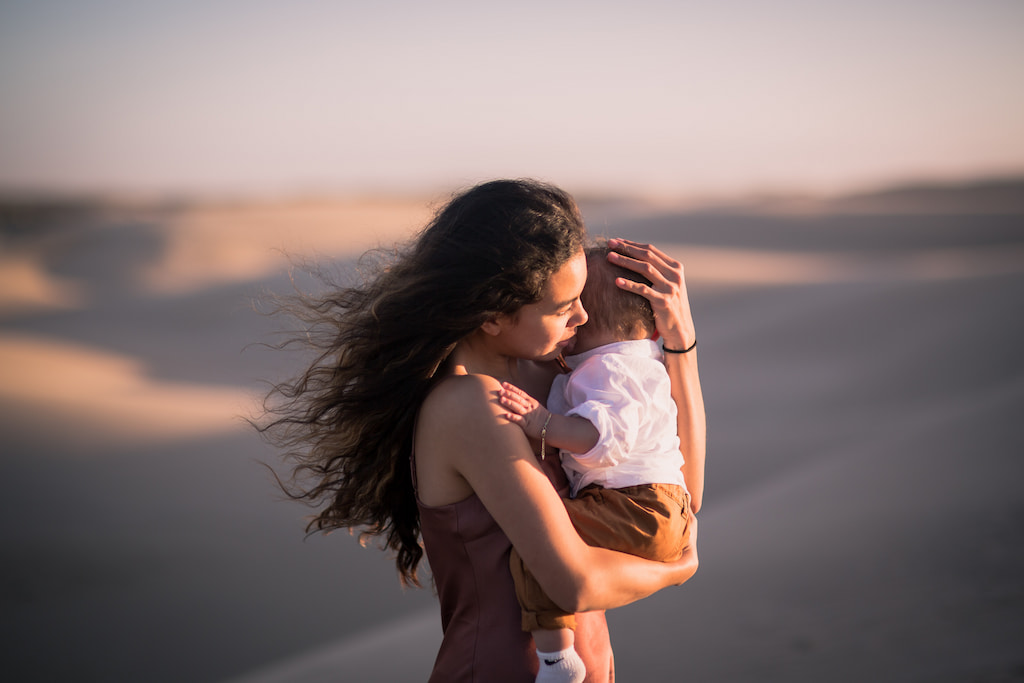 woman hugging a child in a compassionate way