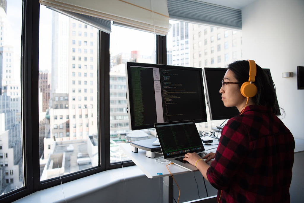 woman with headphones working