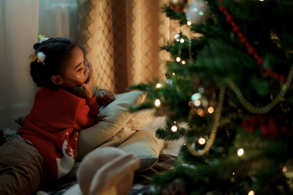 girl standing near the christmas tree