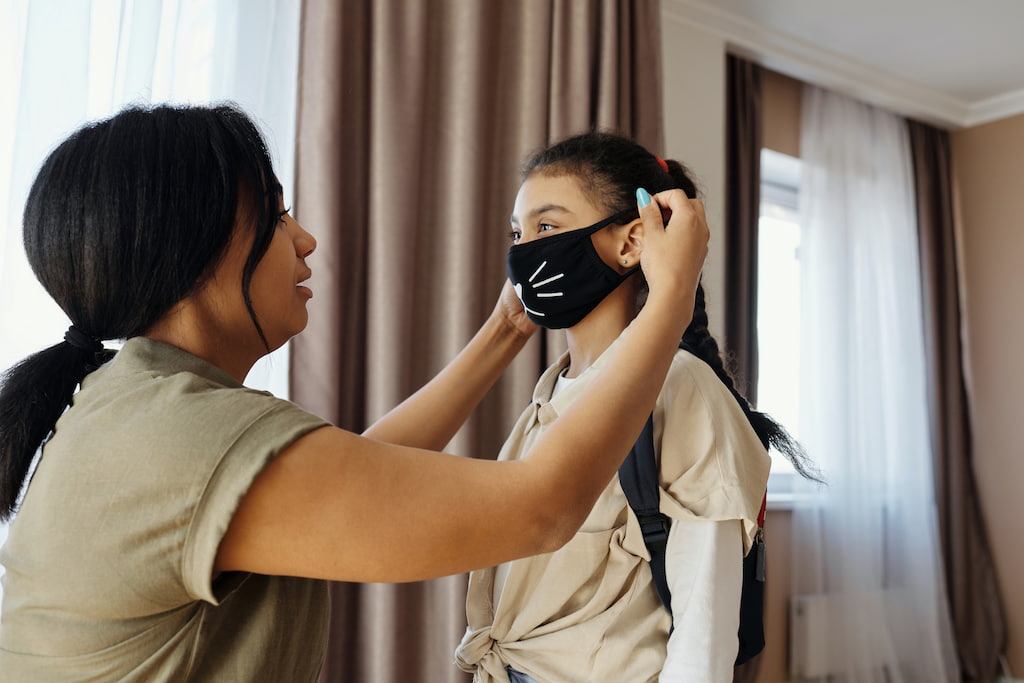 girl wearing a mask