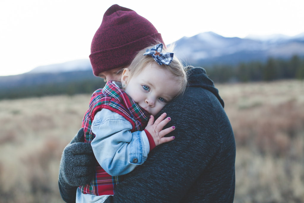 man hugging a child