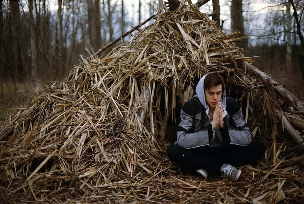 man meditating outside