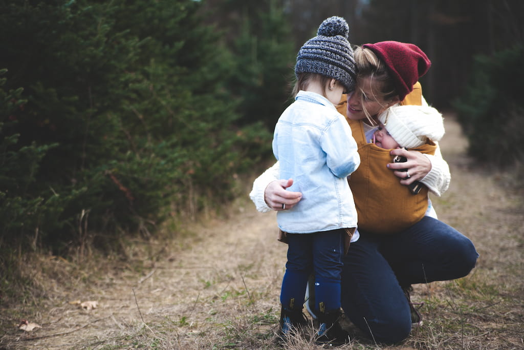 woman and children talking outside