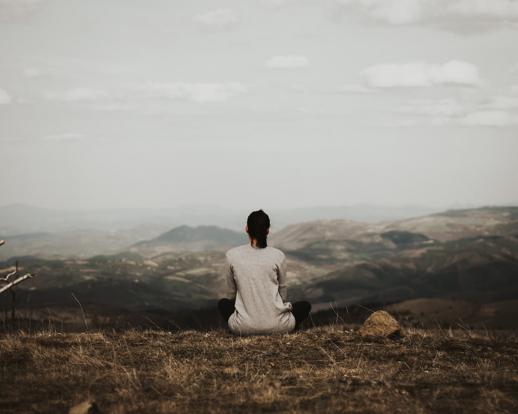 woman meditating outside