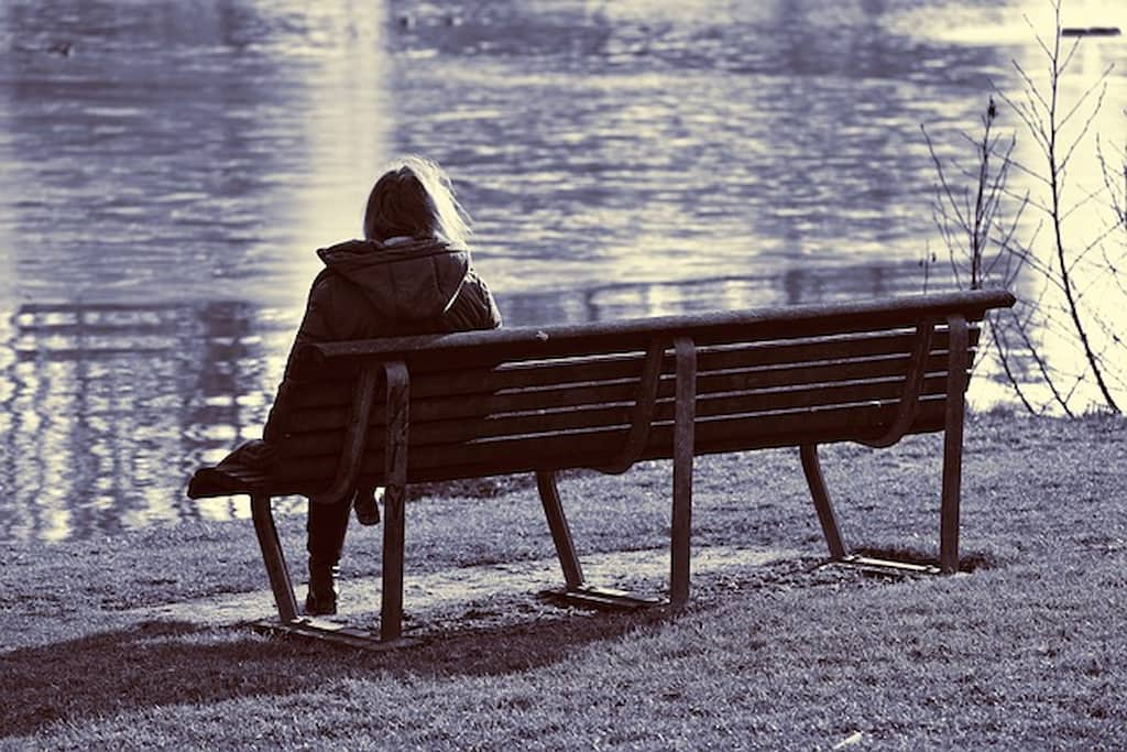 woman sitting on the bench