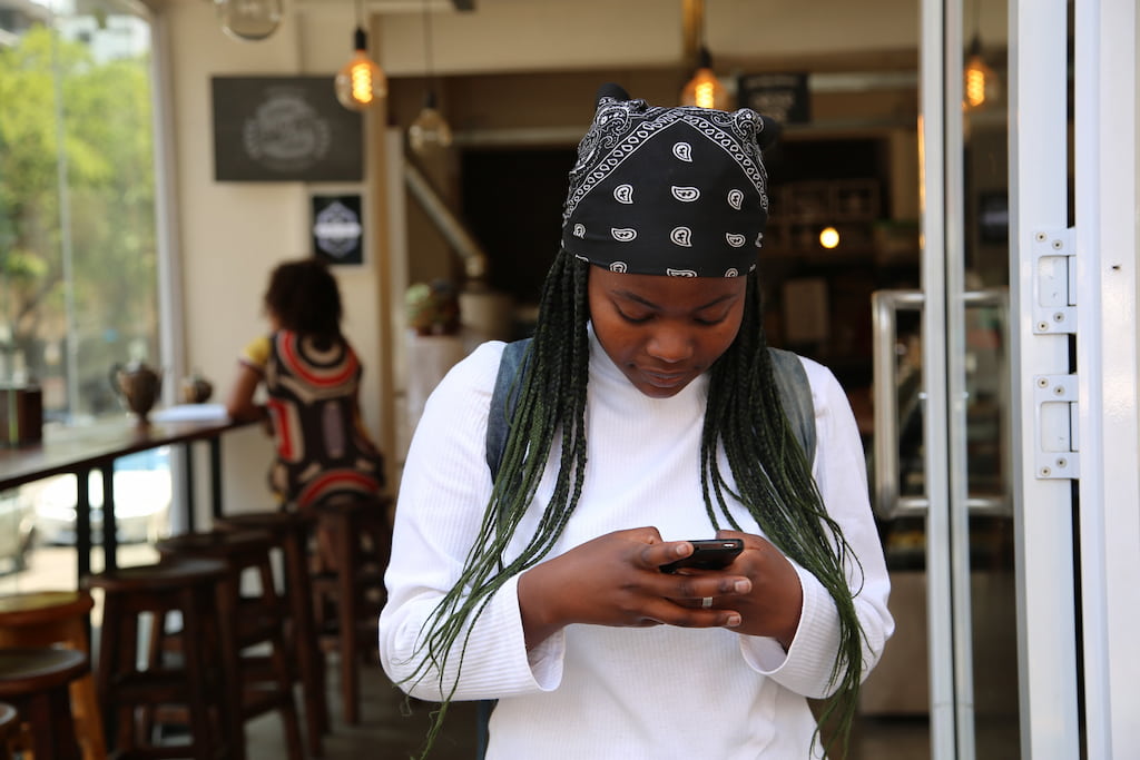 young girl using phone