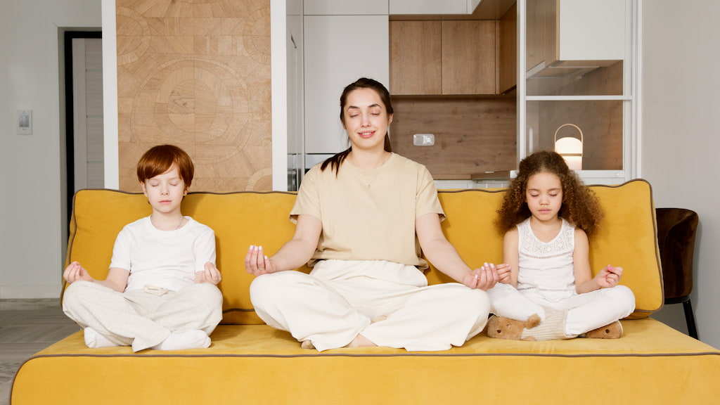 family meditating together