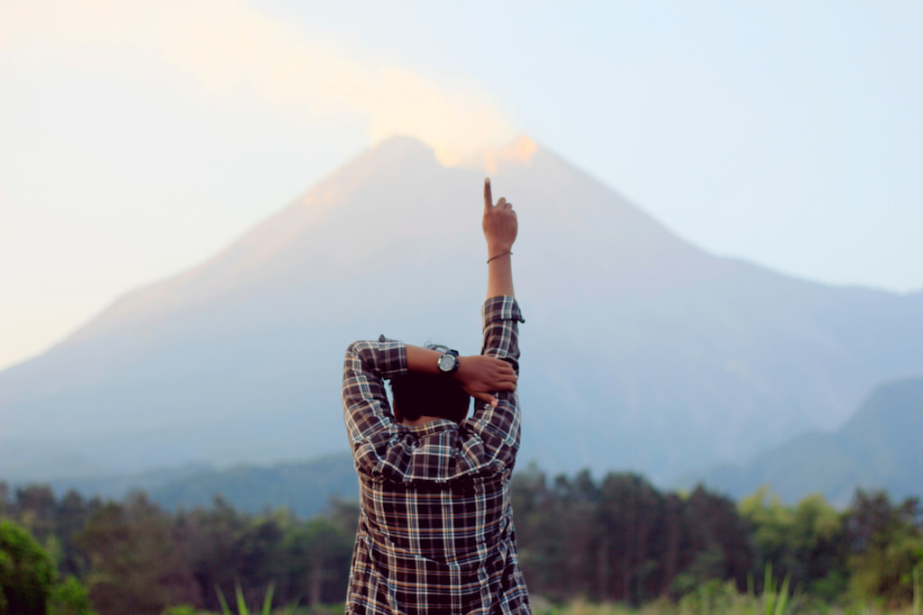 man raising hand